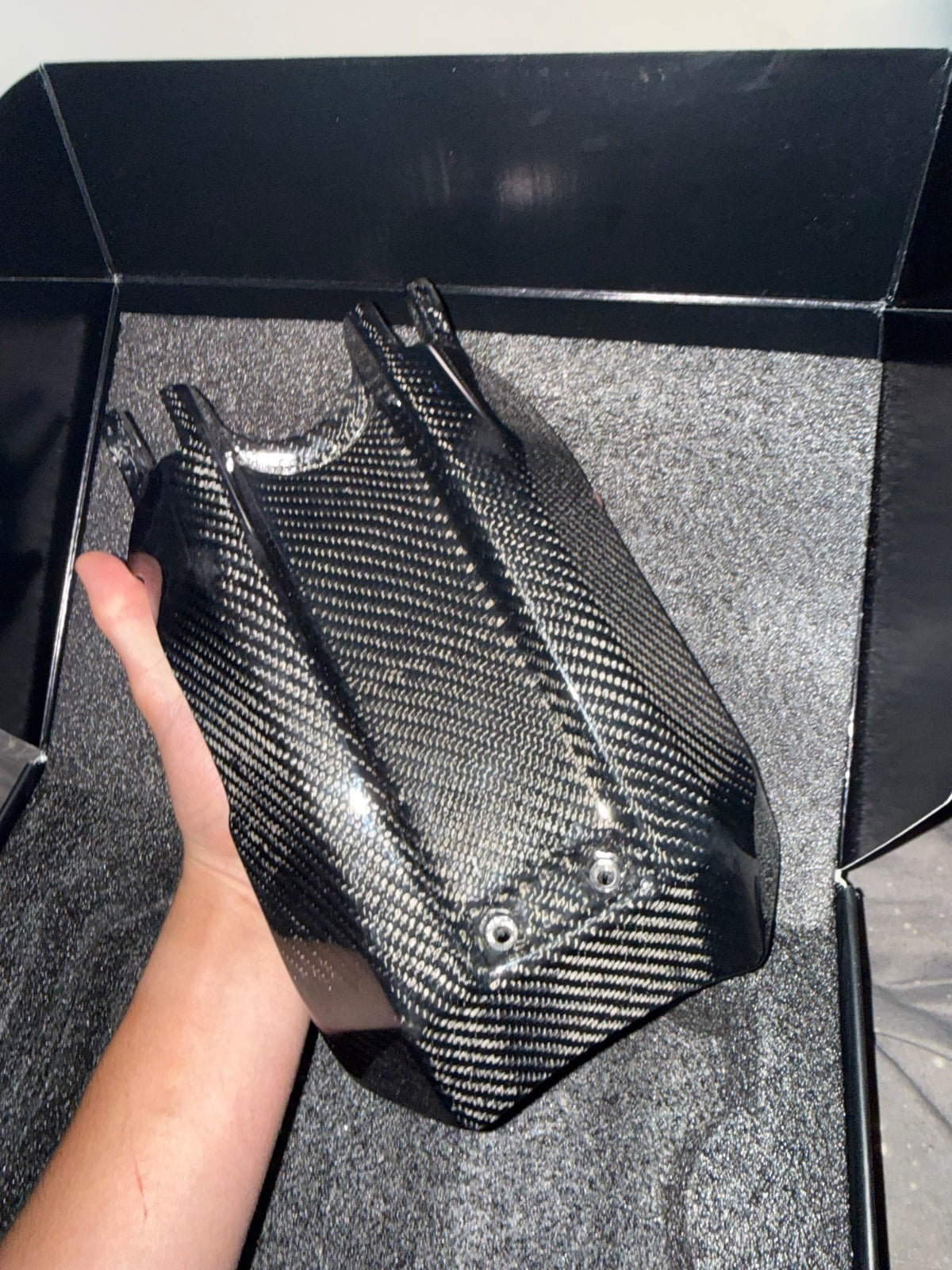 Carbon-fiber e-moto battery lid featured on E-Moto Marketplace